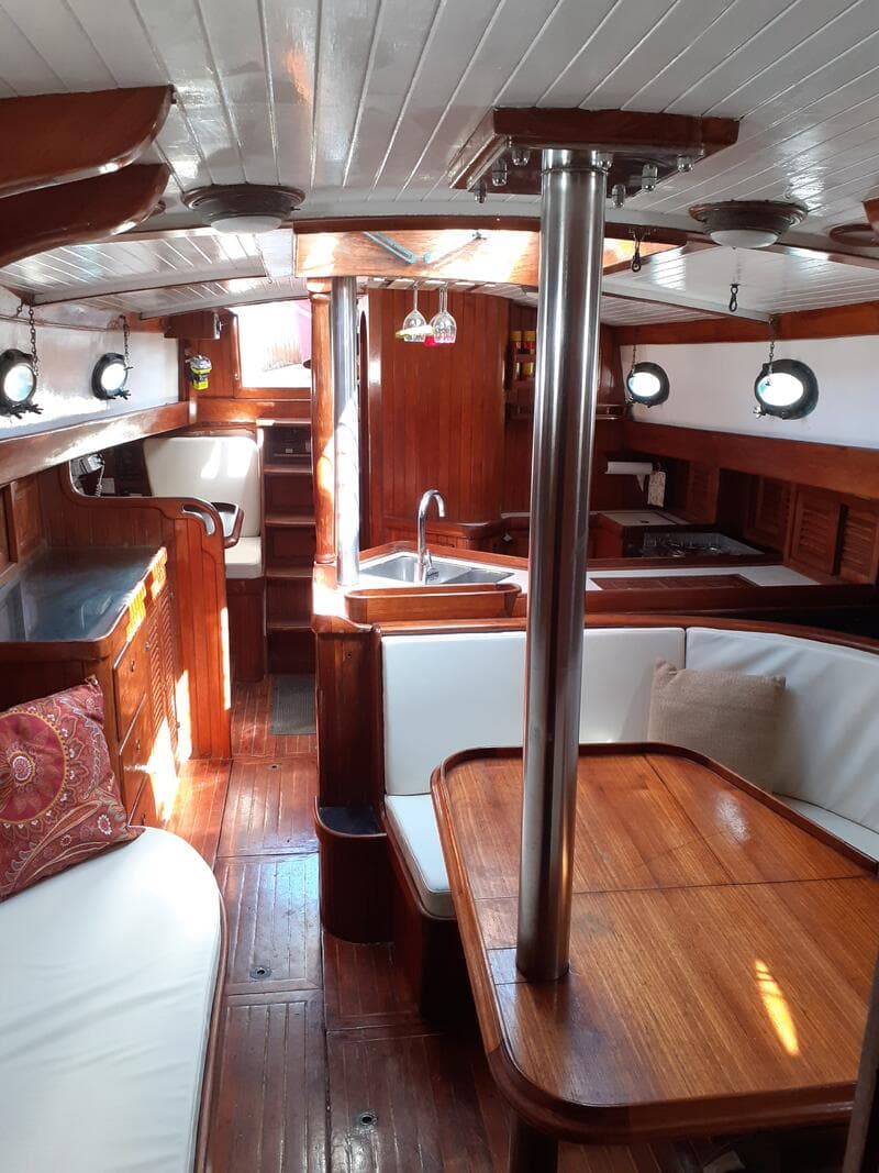 Marco Polo — solid teak interior, saloon and galley
